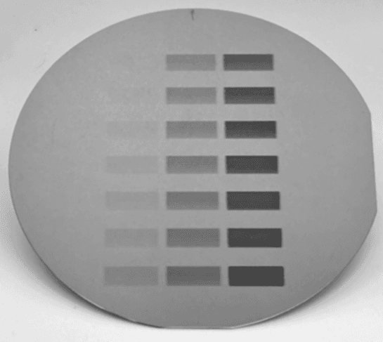 Silicon wafer with dose calibration exposure patches at varying EUV doses
